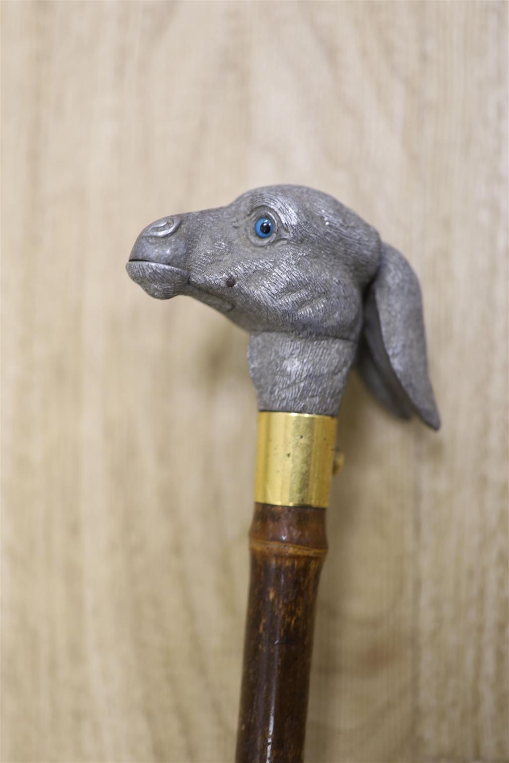 An articulated Brigg donkey head parasol, length 91cm